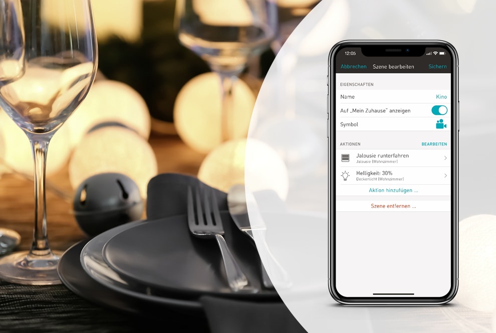 Esstisch mit gedimmtem Licht und Smartphone mit eNet SMART HOME app.